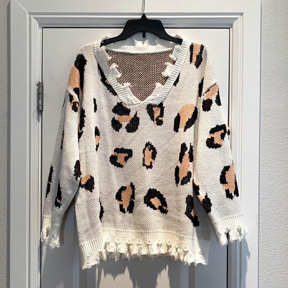 Distressed oversized leopard sweater